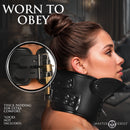 Master Series Rigid Locking Posture Collar with Chin Brace worn during bondage play, featuring adjustable straps and padding.
