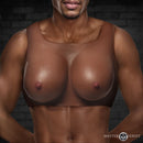 Perky Pair D-Cup Silicone Breasts Dark displayed on a model, highlighting realistic curves and detail.