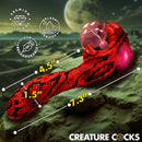 Creature Cocks Cobra Silicone Plasma Vibrator with glowing orb and textured snake design on a cosmic background.