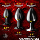 Creature Cocks Red Eye Metal Butt Plug Set 3 Piece with size details and diameters on a red background.