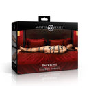 Master Series Backbone Full Body Harness packaging with a model demonstrating the restraint system on a bed.