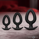 Pop Plugs 3 Piece Hollow Silicone Anal Trainer Set showcasing small, medium, and large plugs on a table.