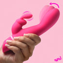 Come Hither Silicone Rabbit Vibrator Pink held in hand, demonstrating its dual stimulation features.