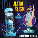 Creature Cum Blue Jizz Water Based Lubricant 8 Oz bottle with blue lube on hand and text highlighting its sleek formula.