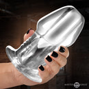Dicked Clear Hollow Anal Plug X-Large held in hand, showcasing its transparent design and ergonomic shape.