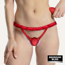 Textured Silicone Panty Vibrator with Remote Red displayed on model wearing red lace panty.