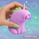 Tappyhorn Tapping Silicone Clitoral Stimulator held in hand with green nails, showcasing its cute unicorn design.