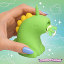 Close-up of the Lickyhorn Green Licking Silicone Clitoral Stimulator in hand, showcasing its unique design and flexible tongue.