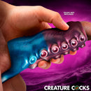 Tentagirth Tentacle Silicone Penis Enhancer held in hand, showcasing its bold texture and design, ideal for partnered play.