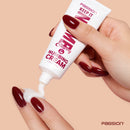 Keep It Numb Anal Numbing Cream 1.5 Oz Cherry being applied from tube onto fingers.
