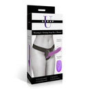 Strap U Thrusting Vibrating Strap-On with Harness Black in packaging, showcasing thrusting action and adjustable fit.