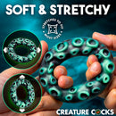 Creature Cocks Octo-Grip Silicone Cock Ring shown in hands, soft and stretchy design with octopus suckers.