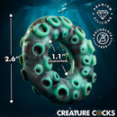 Creature Cocks Octo-Grip Silicone Cock Ring in ocean setting with measurements for size reference.