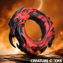Creature Cocks Hell Fang Silicone Cock Ring designed as a horned demon with fangs, finished in striking marbled crimson and black.