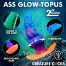 Glowtopus Glow-in-the-Dark Silicone Anal Plug with glowing colors and ergonomic base, featuring a tapered tip and girthy design.