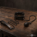 Master Series Constrict Inflatable Collar with Leash Black on a wooden table.