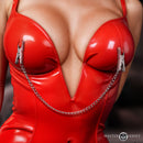 Master Series Naughty Pleasure Steel Nipple Clamps attached to a red latex bodysuit, showcasing intense erotic appeal.