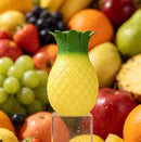 Maia Aloha Pineapple 10 Function Suction Vibrator displayed with vibrant fruits in the background.