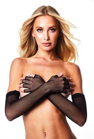 Woman wearing Baci Fingerless Fishnet Opera Gloves in black for an elegant and dramatic look.