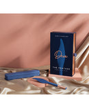 Deia The Feather Vibrating Tickler with Charging Case Navy displayed on a pink satin background.