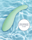 plusOne Petite Pelvic Wand Heated Vibrator shown in water, highlighting its waterproof design for shower or bath use.