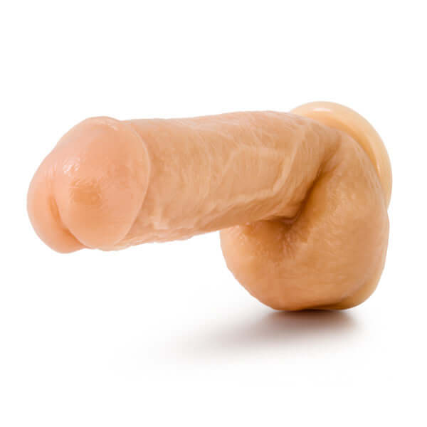 Blush Novelties Hung Rider Trigger Dong - Beige, 8.5-inch realistic dildo with ultra-thick manhood for intense pleasure.