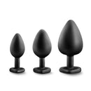 Luxe Bling Plugs Training Kit Black with Rainbow Gems featuring three sizes of sleek black anal plugs.