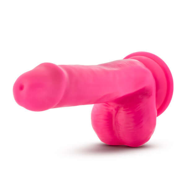 Neo 6-Inch Dual Density Dildo with Balls in vibrant neon pink, designed by Blush Novelties, featuring realistic details and Sensa Feel technology.