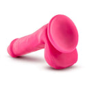Neo 6-Inch Dual Density Dildo with Balls in Neon Pink by Blush Novelties, featuring realistic sculpting and Sensa Feel technology for comfort and rigidity.