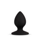Temptasia Slut Butt Plug Black standing upright, made of smooth body-safe materials for comfortable exploration.