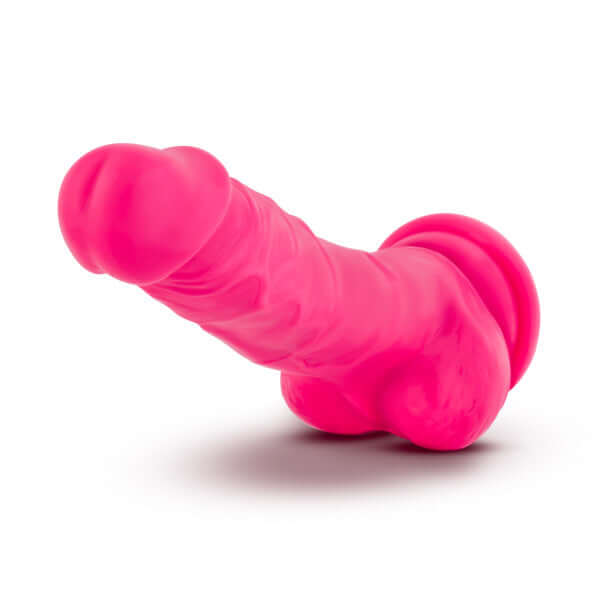Neo Dual Density Dildo in neon pink, 7.5 inches, with balls, realistic feel, suction cup base for versatility.