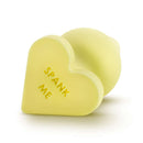 Naughty Candy Heart Spank Me Butt Plug Yellow featuring a playful heart design with 'SPANK ME' engraved.