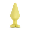 Naughty Candy Heart Spank Me Butt Plug Yellow displayed against a white background, showcasing its playful design.