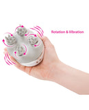 Swan Personal Massage System Body Massager White demonstrating rotation and vibration features in a hand.