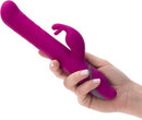Commotion Samba Raspberry Pink Rabbit Vibrator held in hand, showcasing its unique rabbit-style design for pleasure.