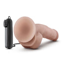 Dr Skin Dr Jay 8.75 inches Vibrating Cock with Suction Cup Vanilla beside remote control for adjustable vibration.
