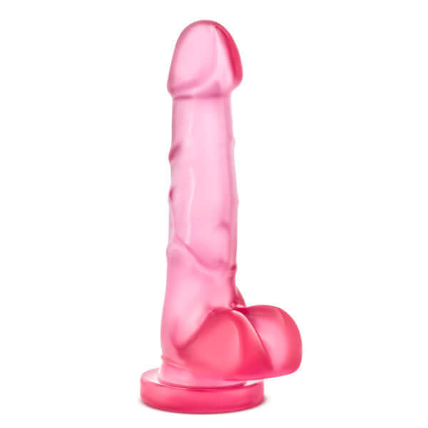 Realistic pink dildo with lifelike details and suction cup base for hands-free play