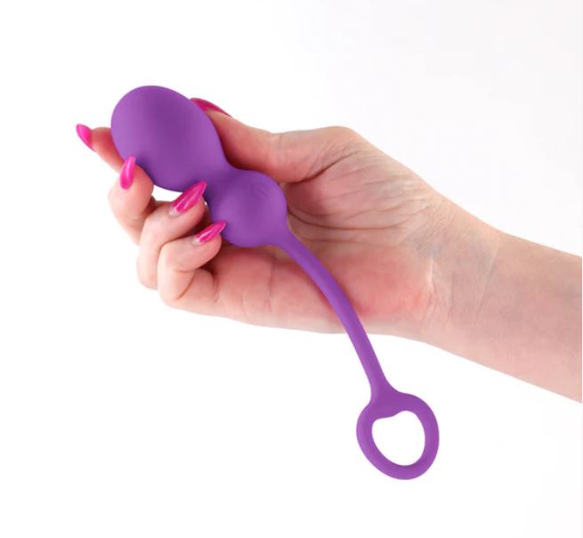 Techno Bop App Compatible Vibrator Purple held in hand, showcasing the luxurious silicone and ergonomic design.
