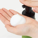 Tenga Iroha Intimate Wash Bergamot 150 ml foaming cleanser in hand for intimate hygiene.