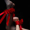 Red bowknot restraint straps elegantly binding wrists and ankles, enhancing playful intimacy and surrender.