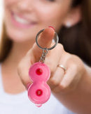 Super Fun Key Chain Boobie Flashlight held by a smiling woman, showcasing its playful design and features.