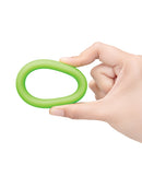 b-Vibe Snug Ring 45 mm Soft Stretch Silicone Cock Ring Green held in hand for perspective on size and texture.