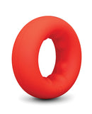 b-Vibe Flex Ring Grip Super Soft Silicone Cock Ring Red against a plain background, showcasing its smooth texture.