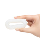 b-Vibe Flex Ring Loop Super Soft Silicone Cock Ring Clear held in hand, showcasing its innovative loop design.
