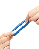 b-Vibe Flex Ring Delta Super Soft Silicone Cock Ring Blue being pulled by hands to showcase flexibility.