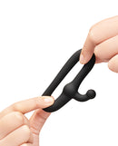 b-Vibe Flex Ring Tap Super Soft Silicone Cock Ring being held to demonstrate its stretchy design.