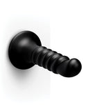 b-Vibe Krush 9.5 Inch Curved Ribbed XXL Suction Cup Dildo mounted on a surface, showcasing its textured design.