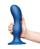 b-Vibe Milk 8.5 Inch Curved XXL Anal Trainer held in hand, showcasing its ergonomic design and elegant S-curve.