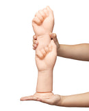 b-Vibe Fists 14.5 Inch Realistic XXL Suction Cup Dildo held in hand showcasing realistic design and size.