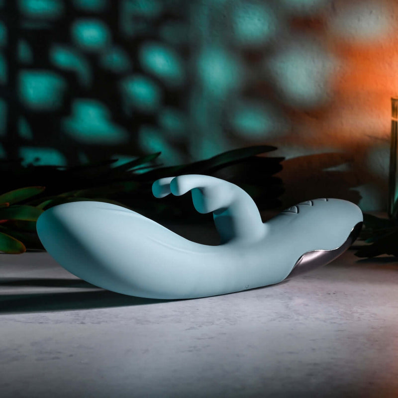 EVOLVED BOSS BUNNY Silicone Rabbit Vibrator with dual motors on display, featuring a sleek design and curved shaft for enhanced pleasure.